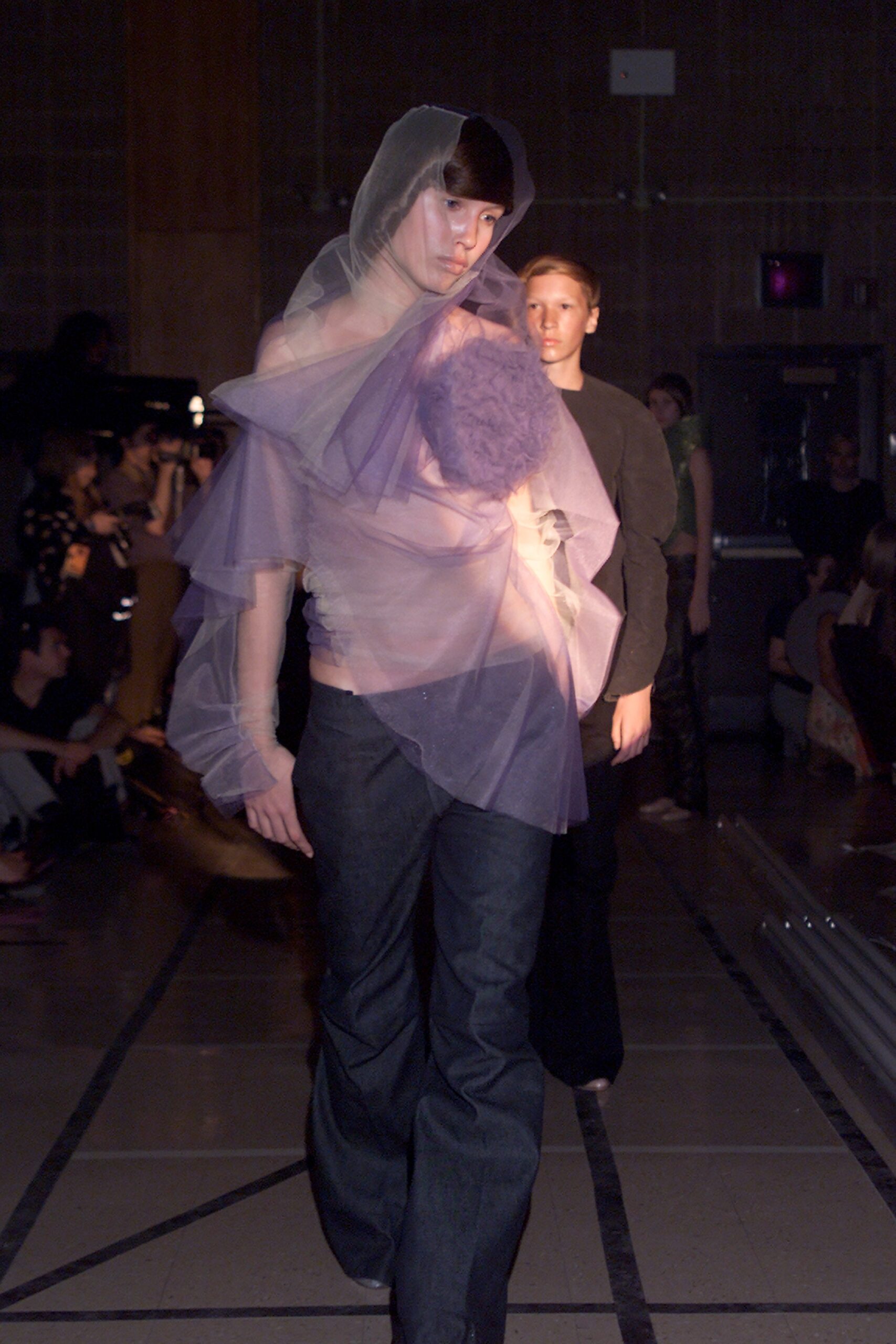 purple tulle top with blue denim pants