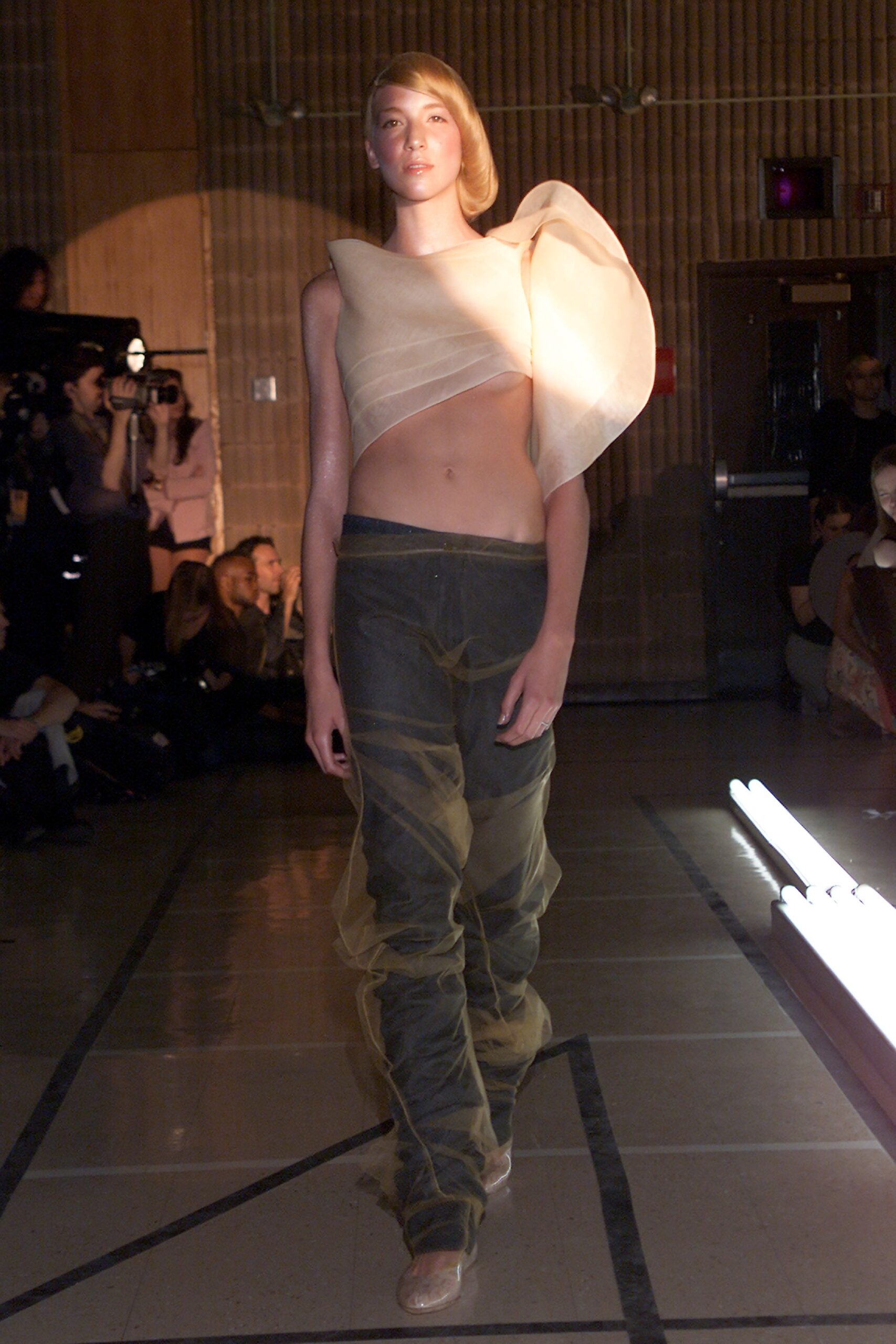 beige asymmetric chiffon top and green relaxed pants