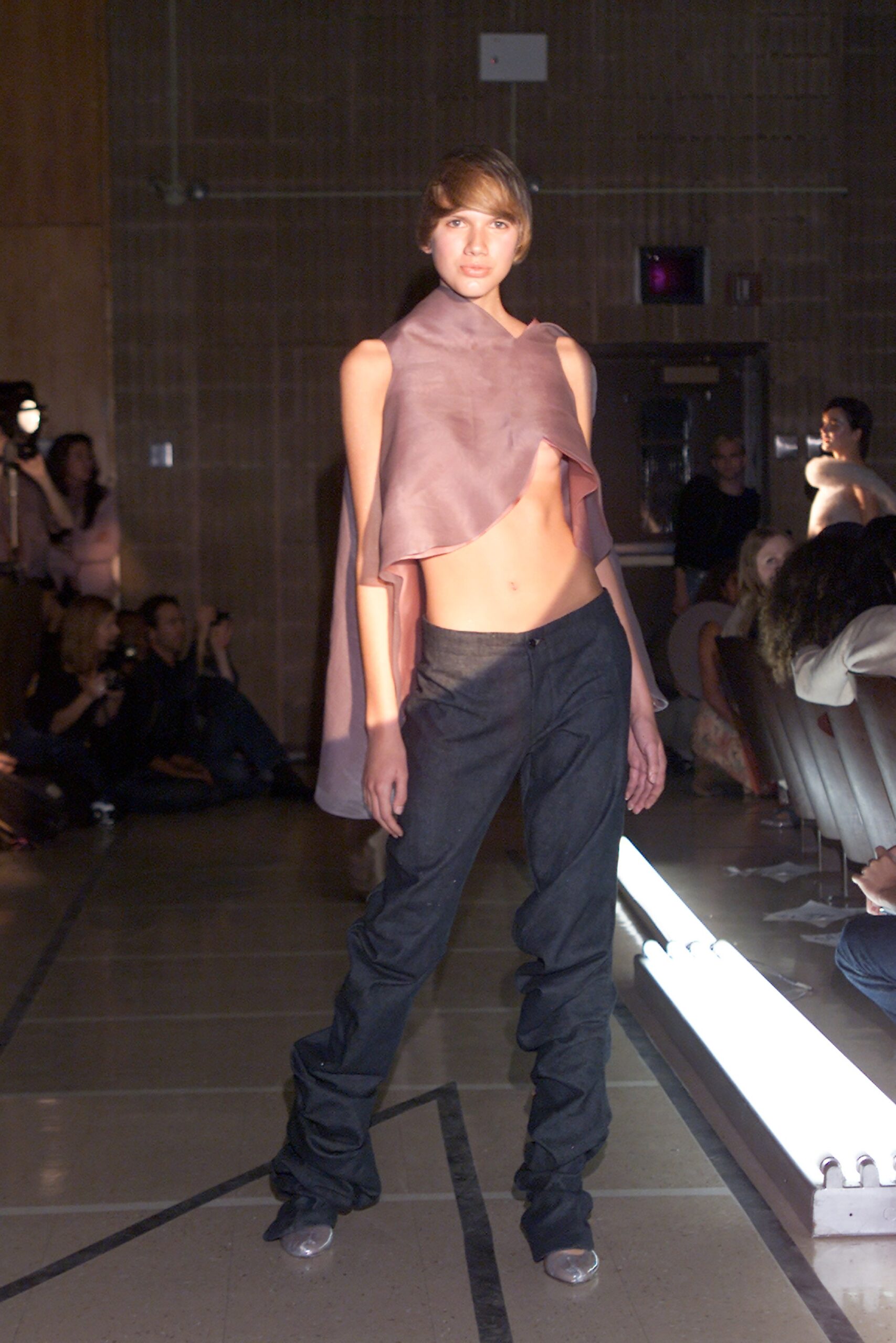 pink silk sleeveless top and black denim pants