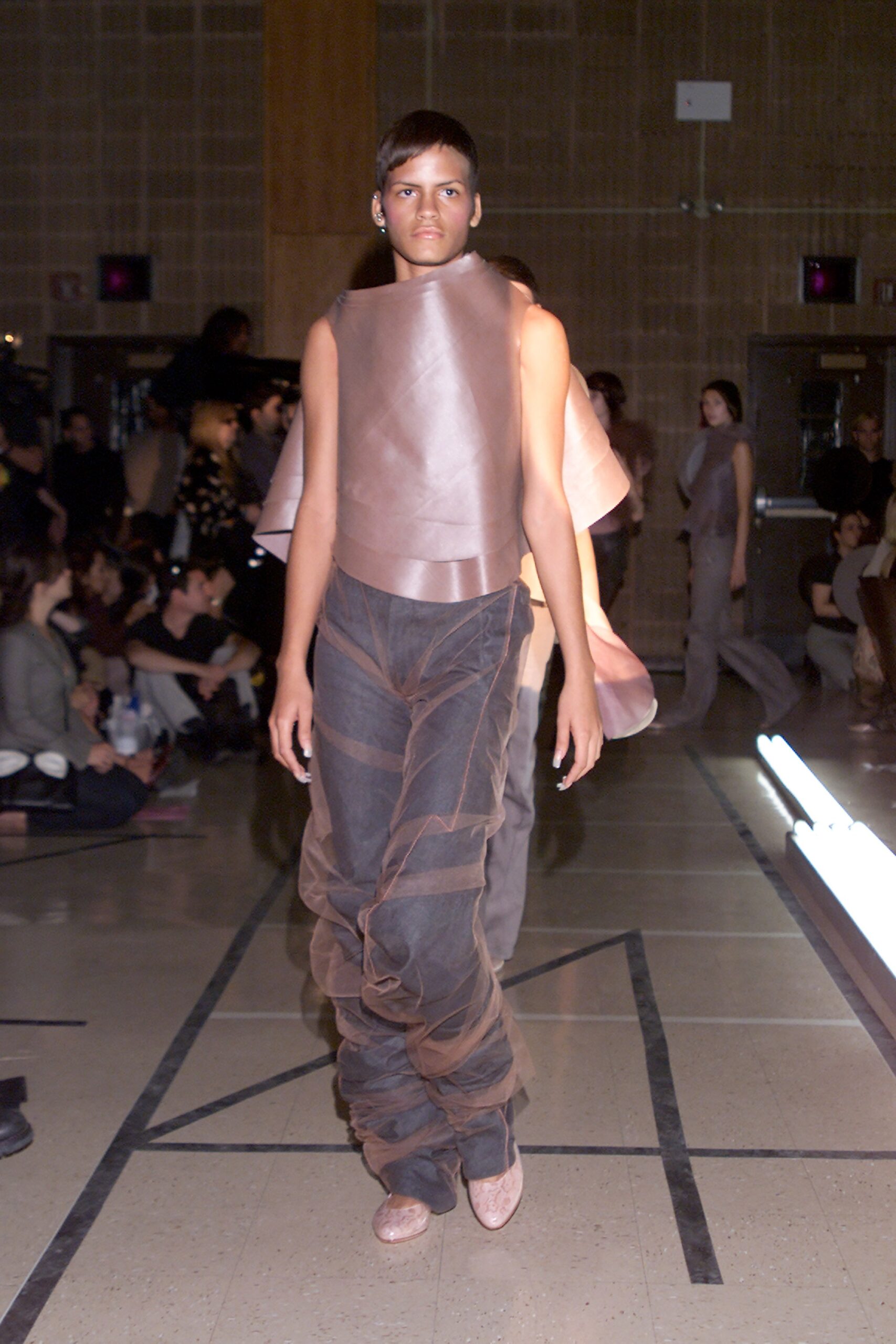 brown silk sleeveless top and gray pants