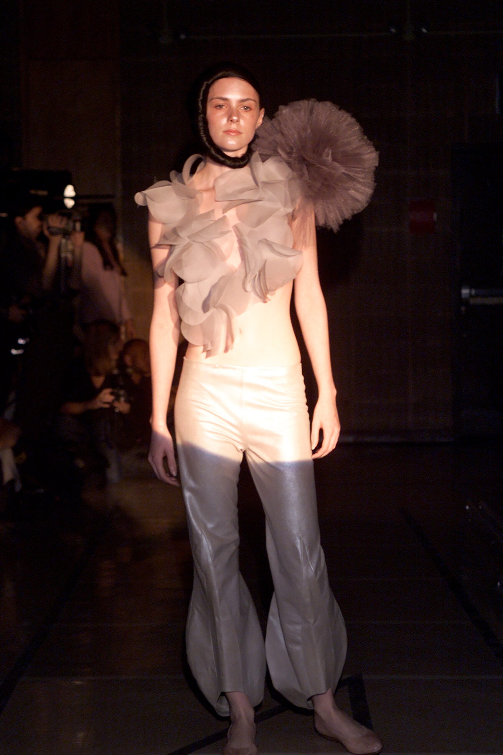 beige silk sleeveless top and gray pants