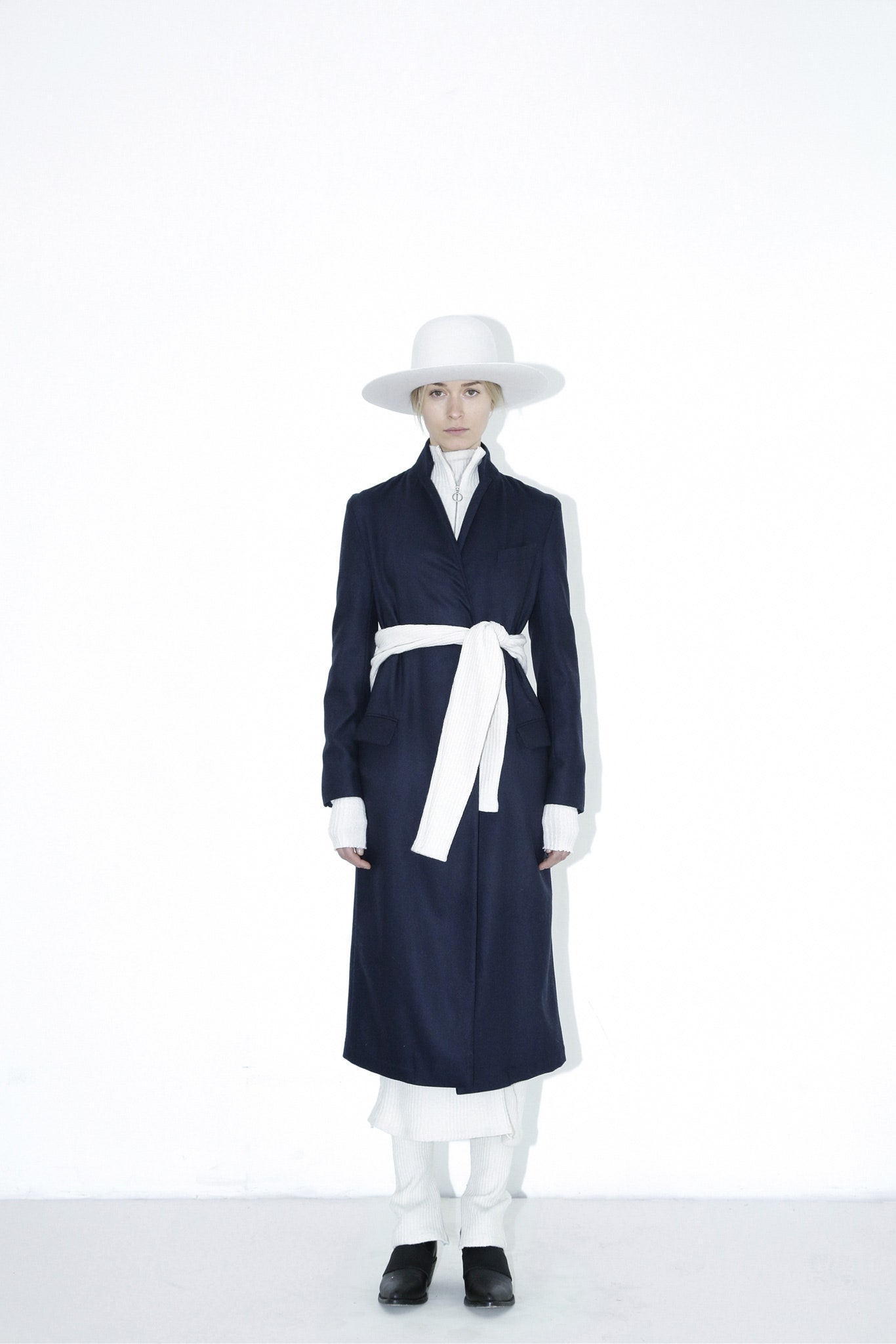 navy coat with white shirt and pants