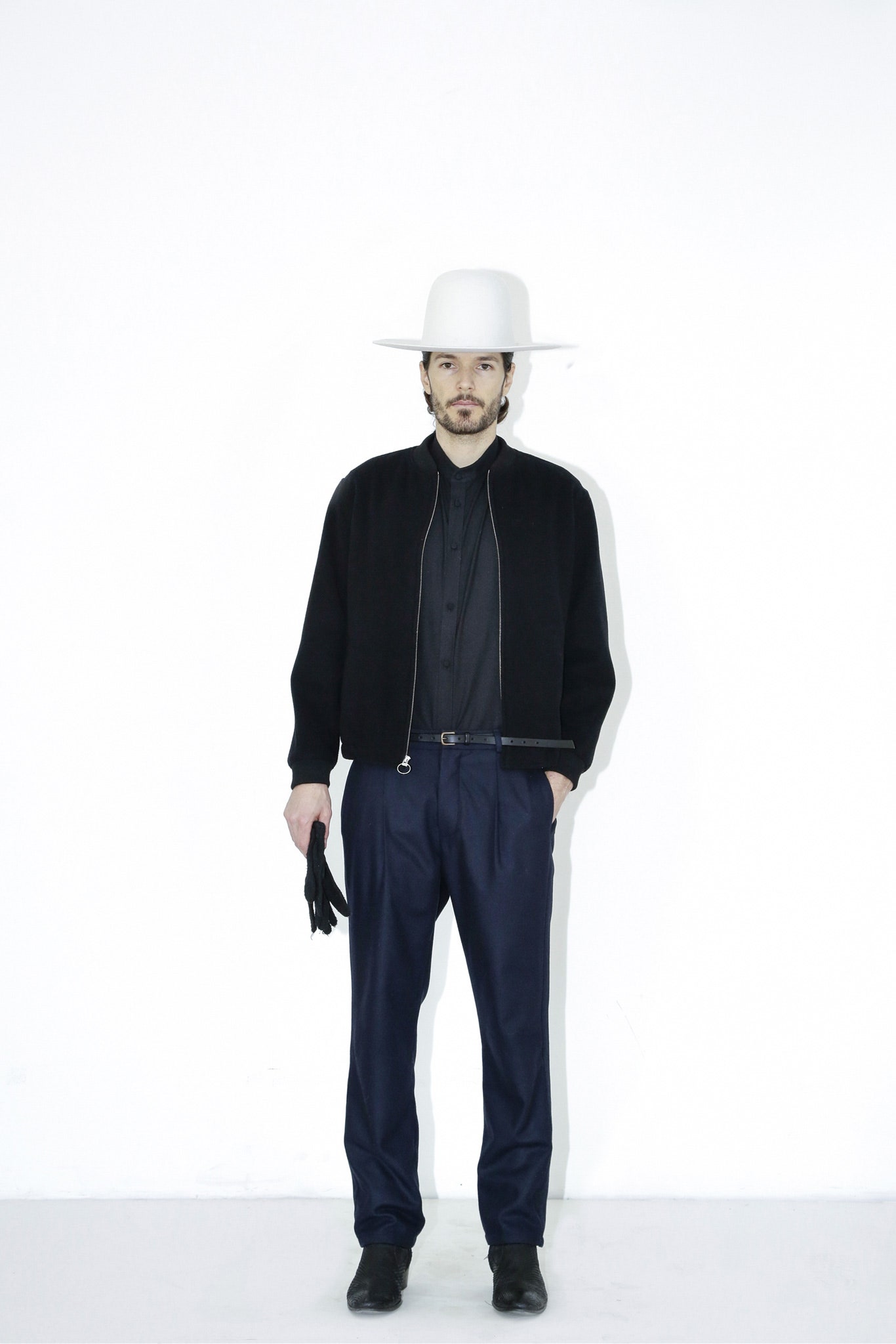 black wool jacket with white hat