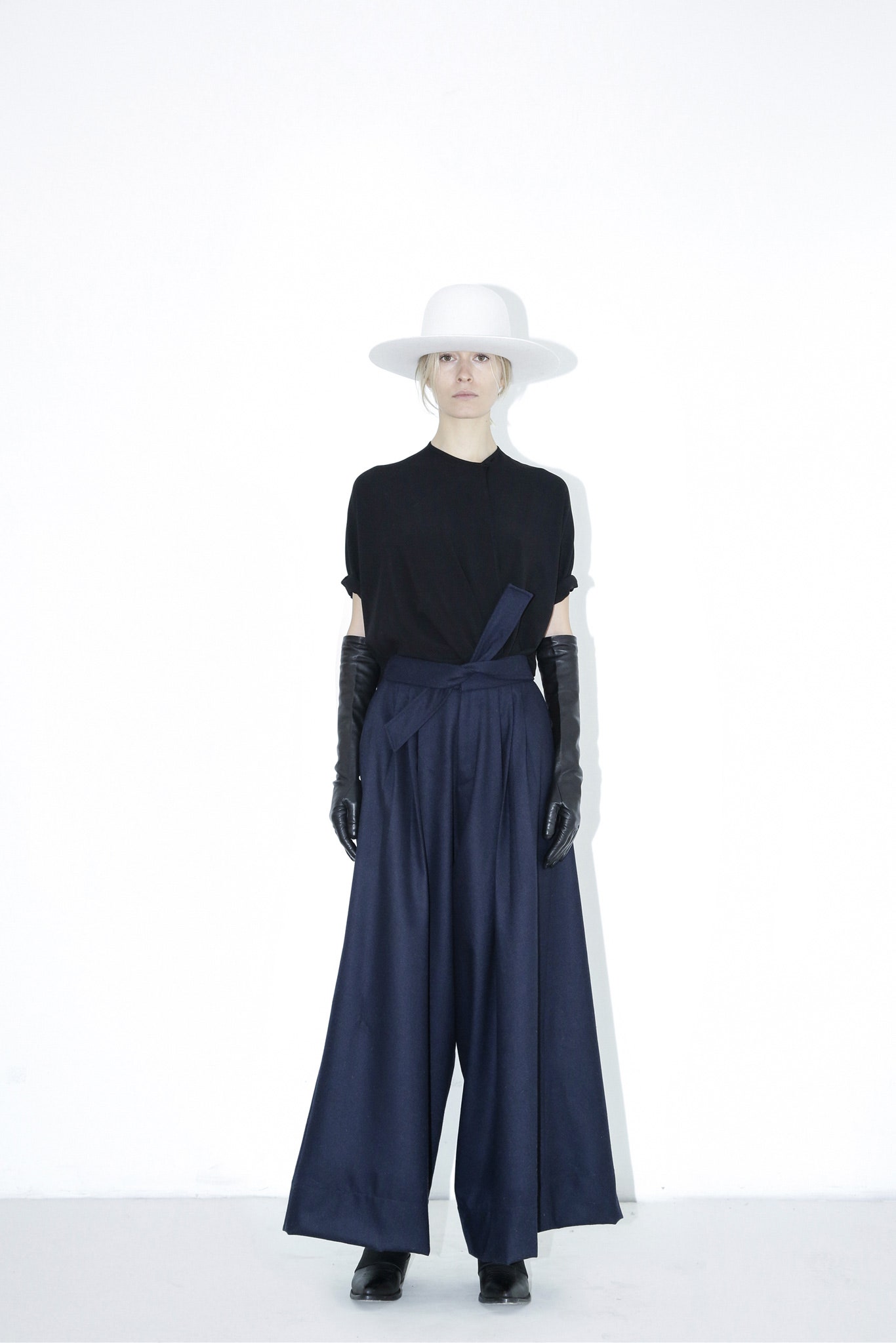 black relaxed top with navy wide-leg pants