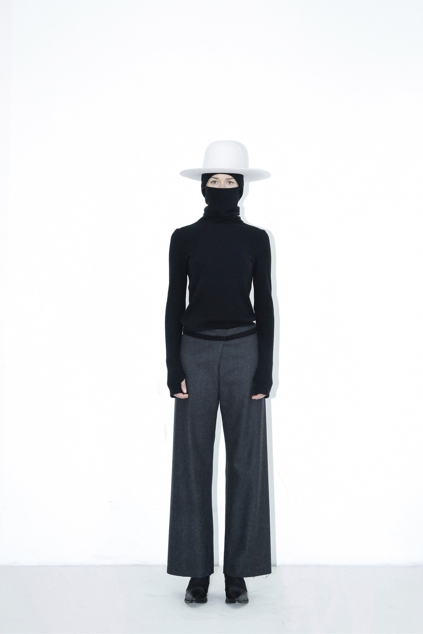 black fitted turtleneck gray wide-leg pants