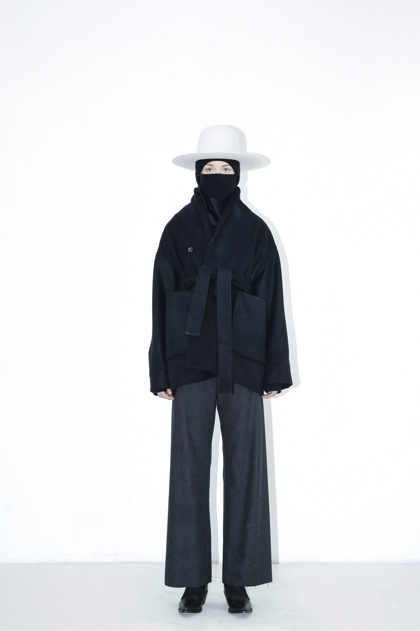 black wool relaxed jacket and gray wide-leg pants