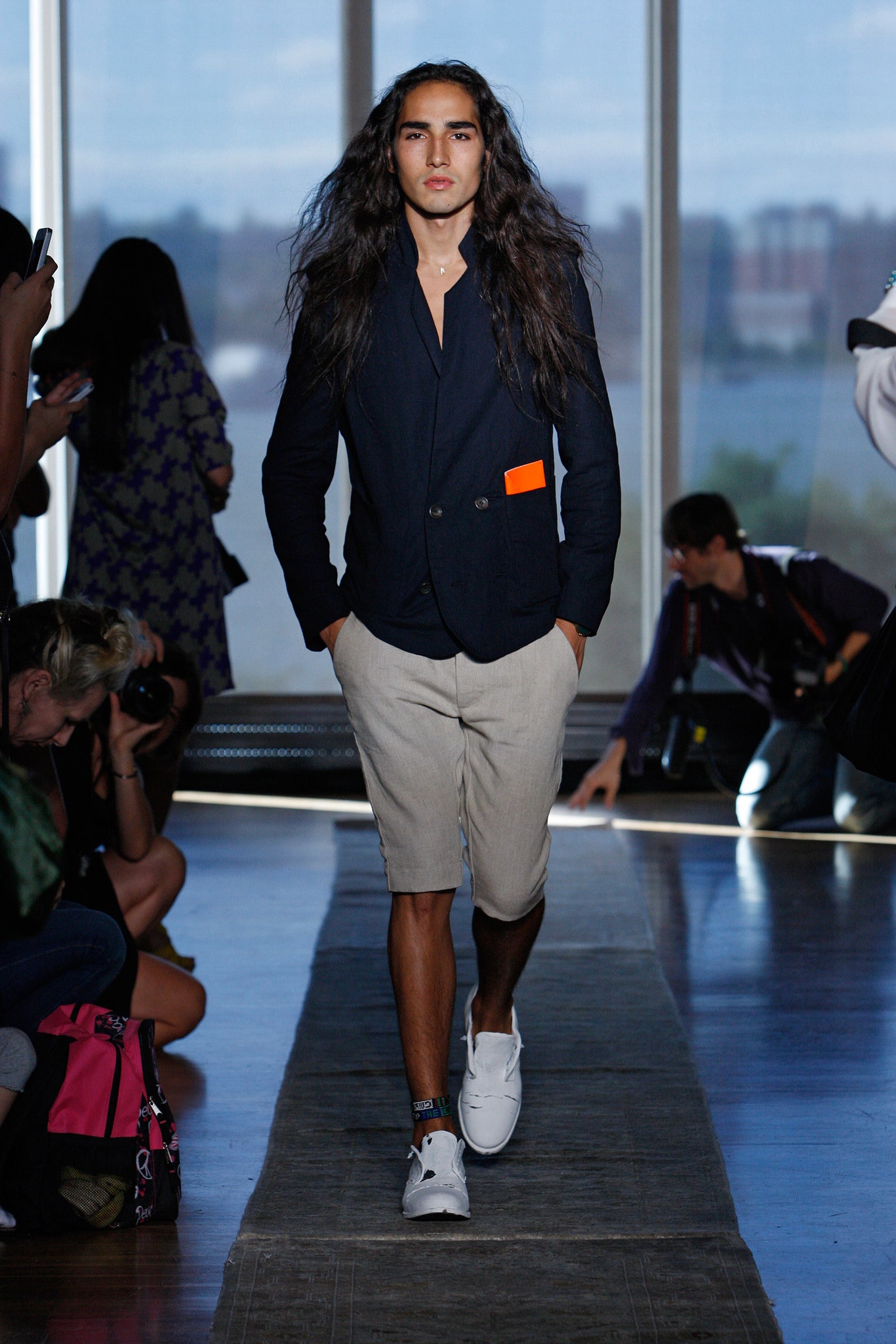 black tailored blazer with beige shorts