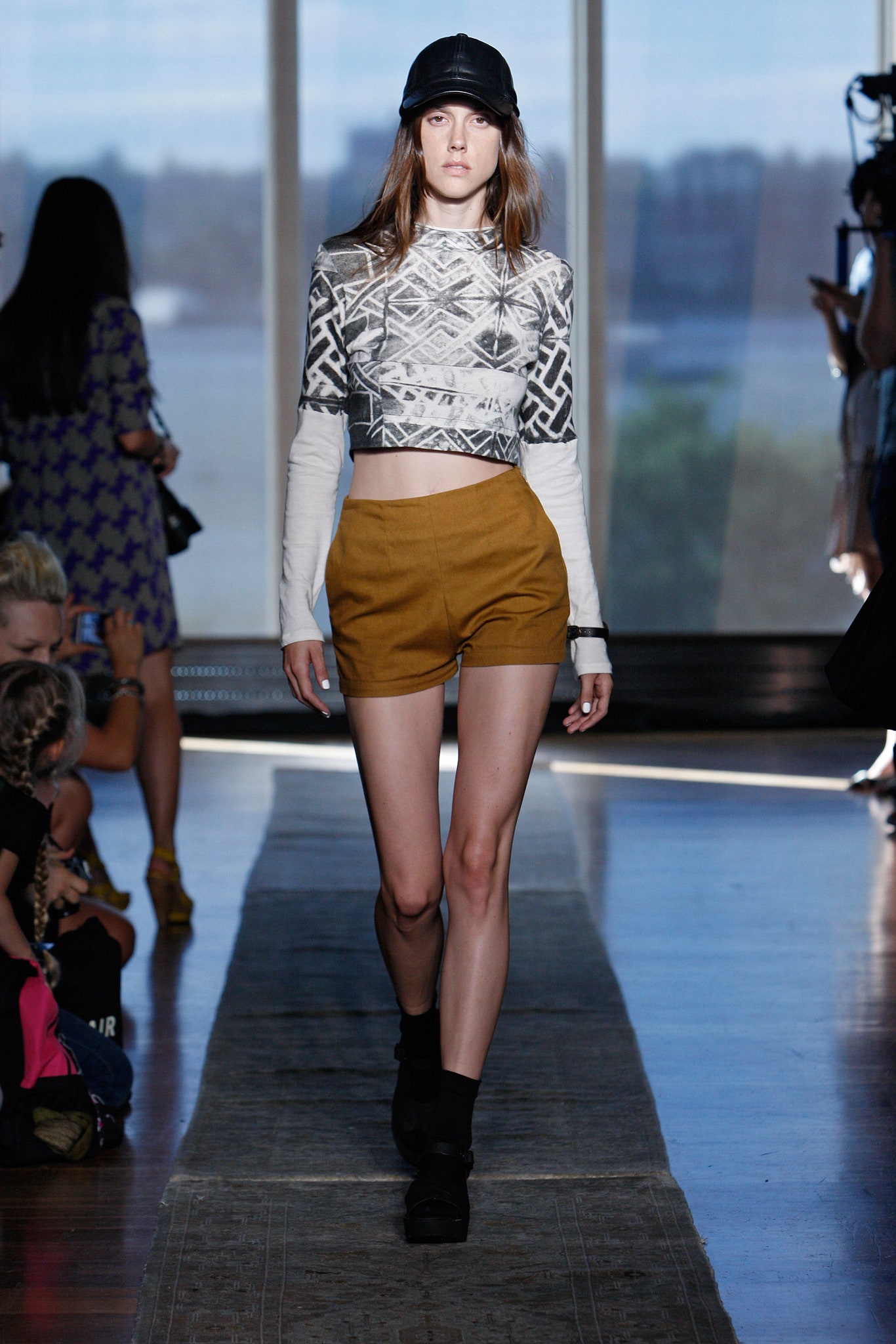 black and white printed crop-top with brown shorts