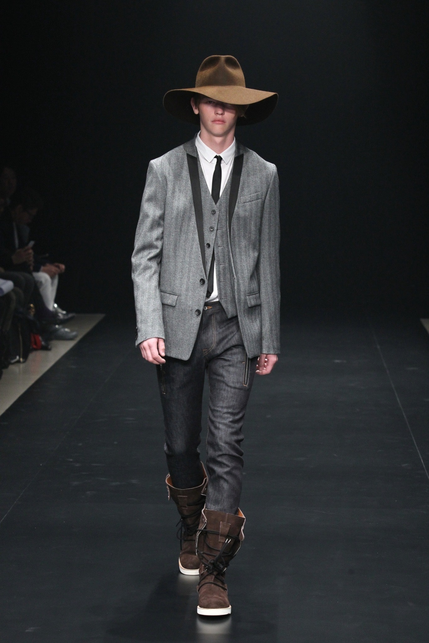 gray tailored suit with brown hat