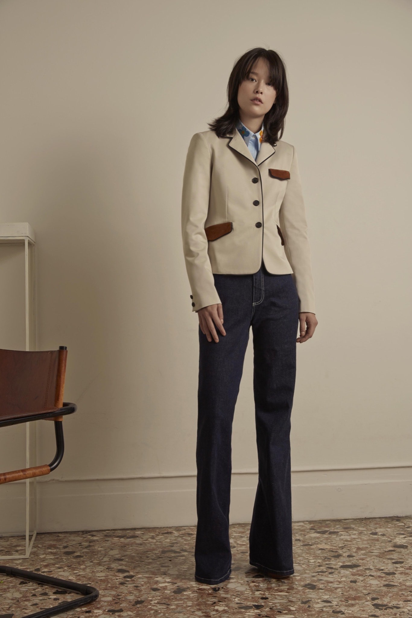 beige tailored blazer with flared jeans