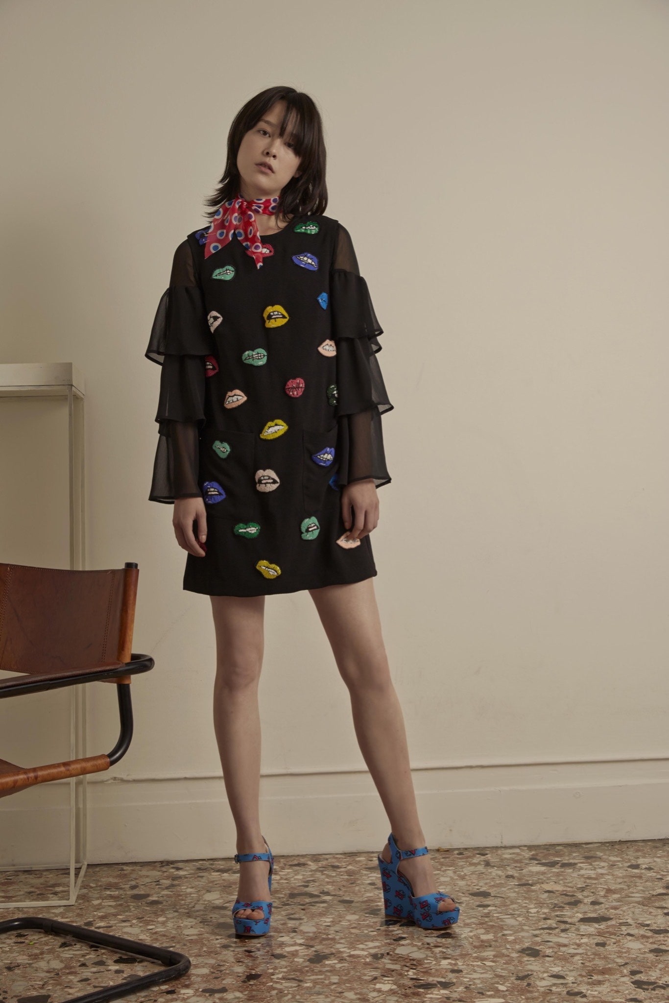 black ruffled dress with blue shoes