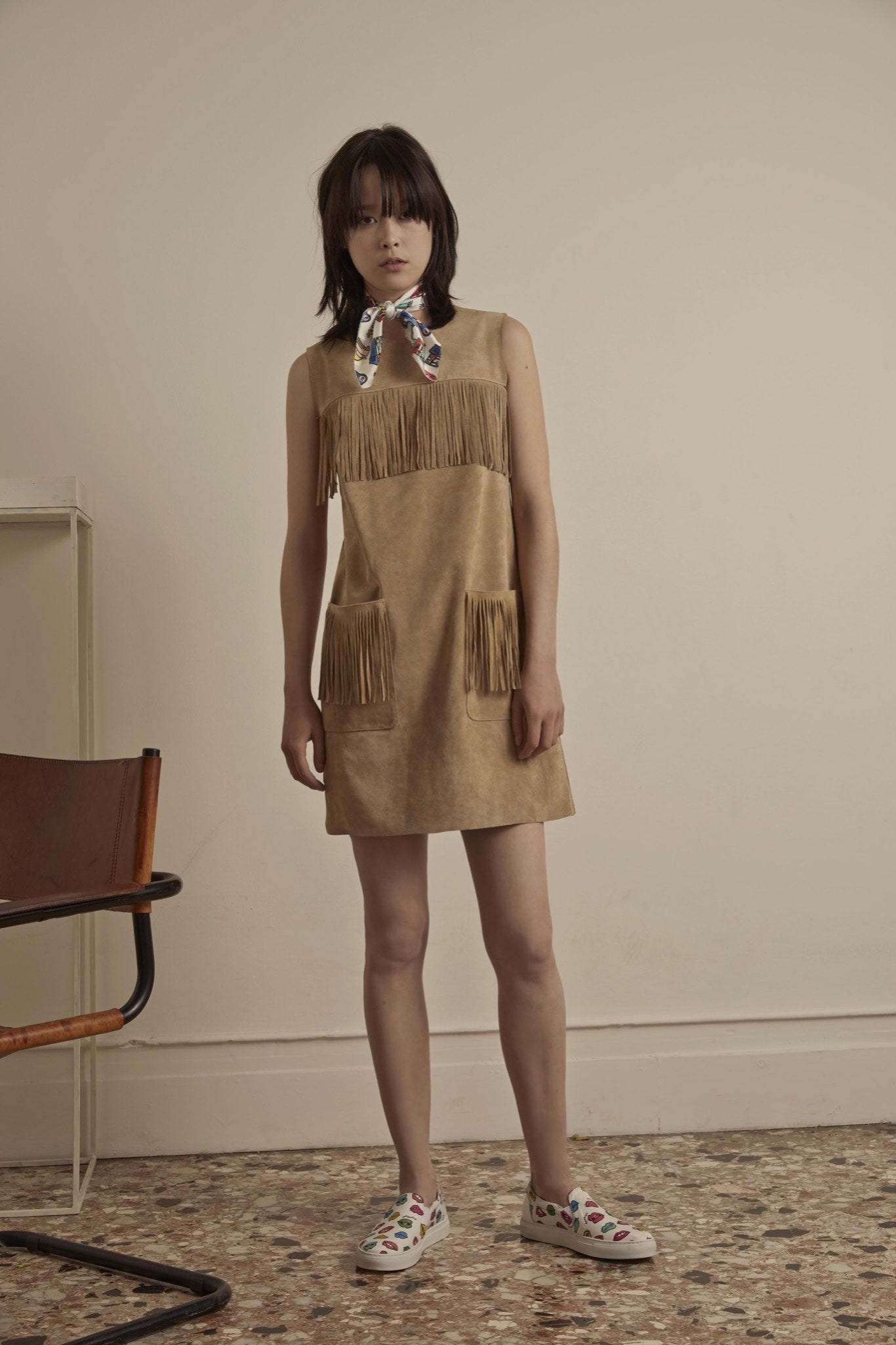 beige suede sleeveless high-neck fitted fringed pockets dress