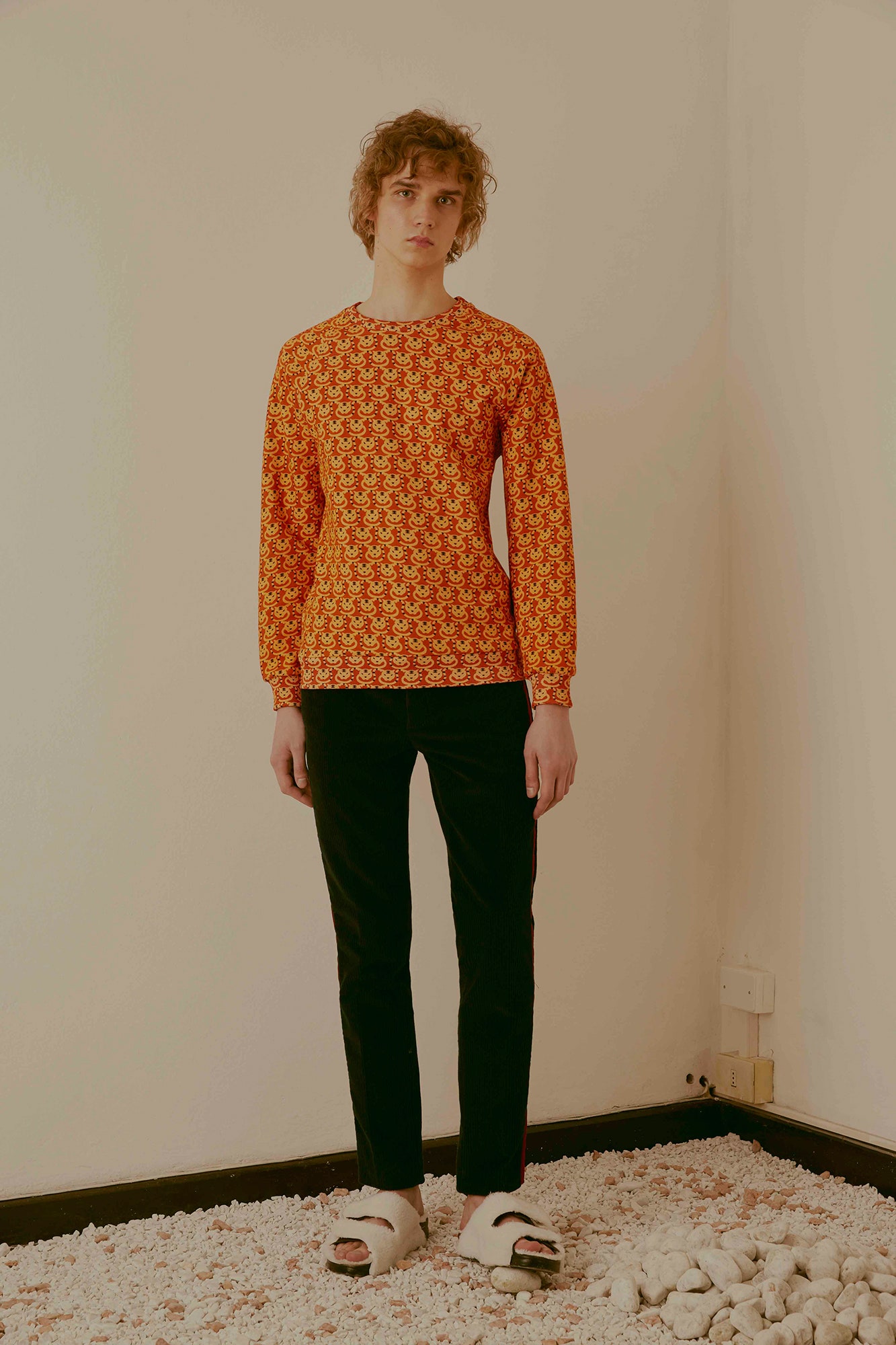 red printed long-sleeve top with black pants