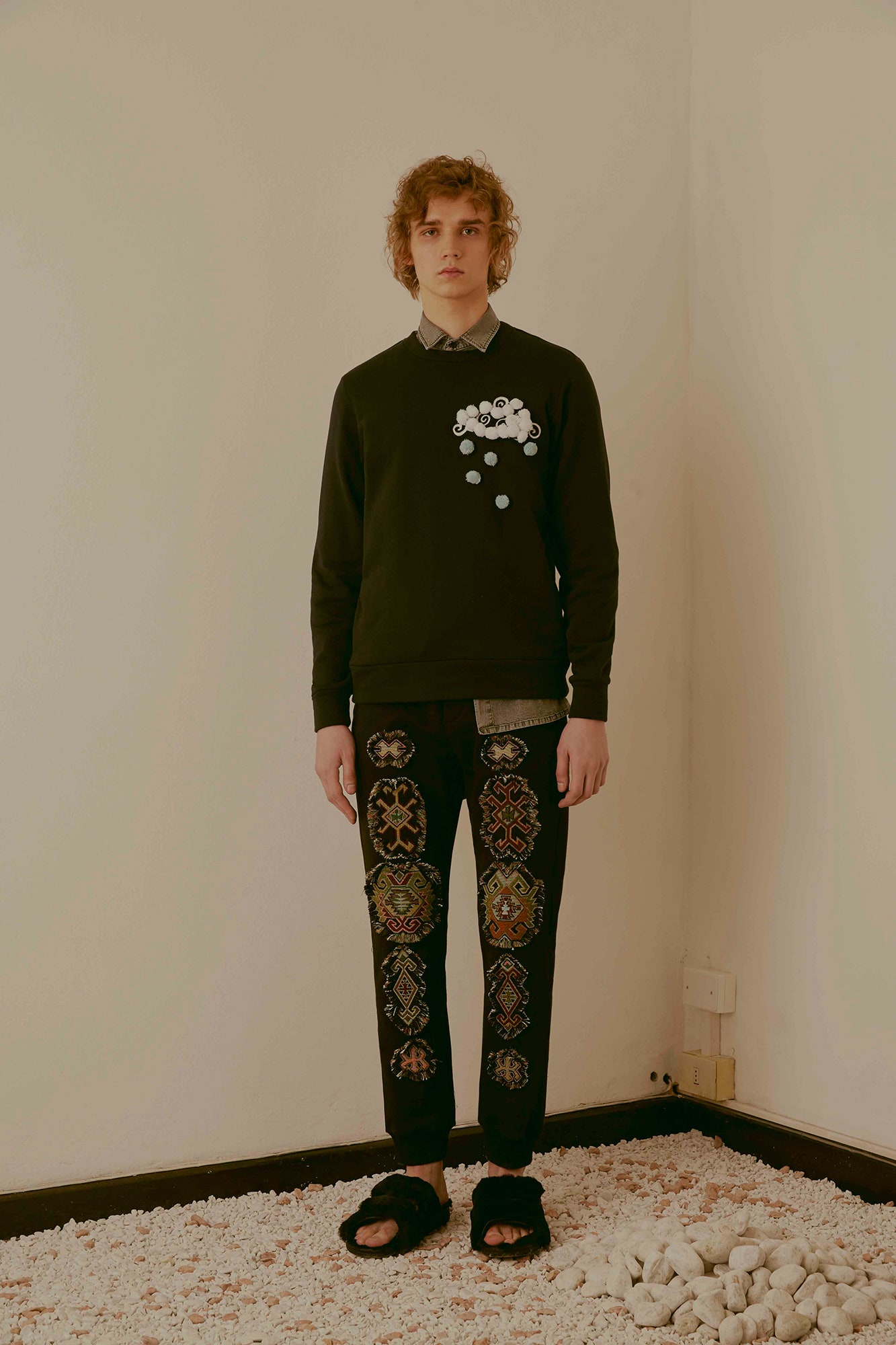 black relaxed sweater and fitted pants