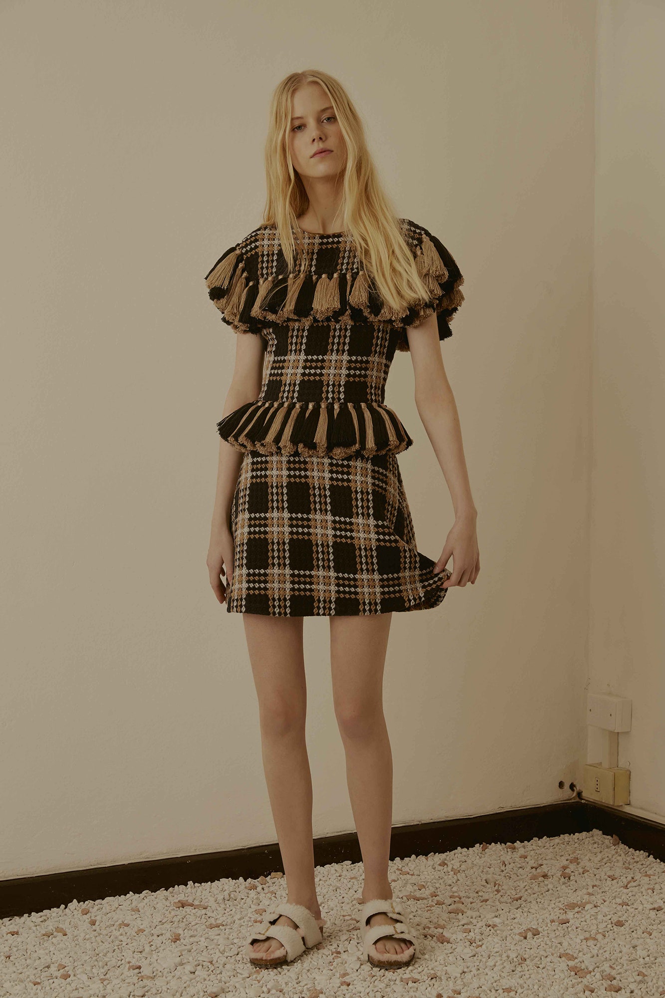 black and beige ruffled mini dress