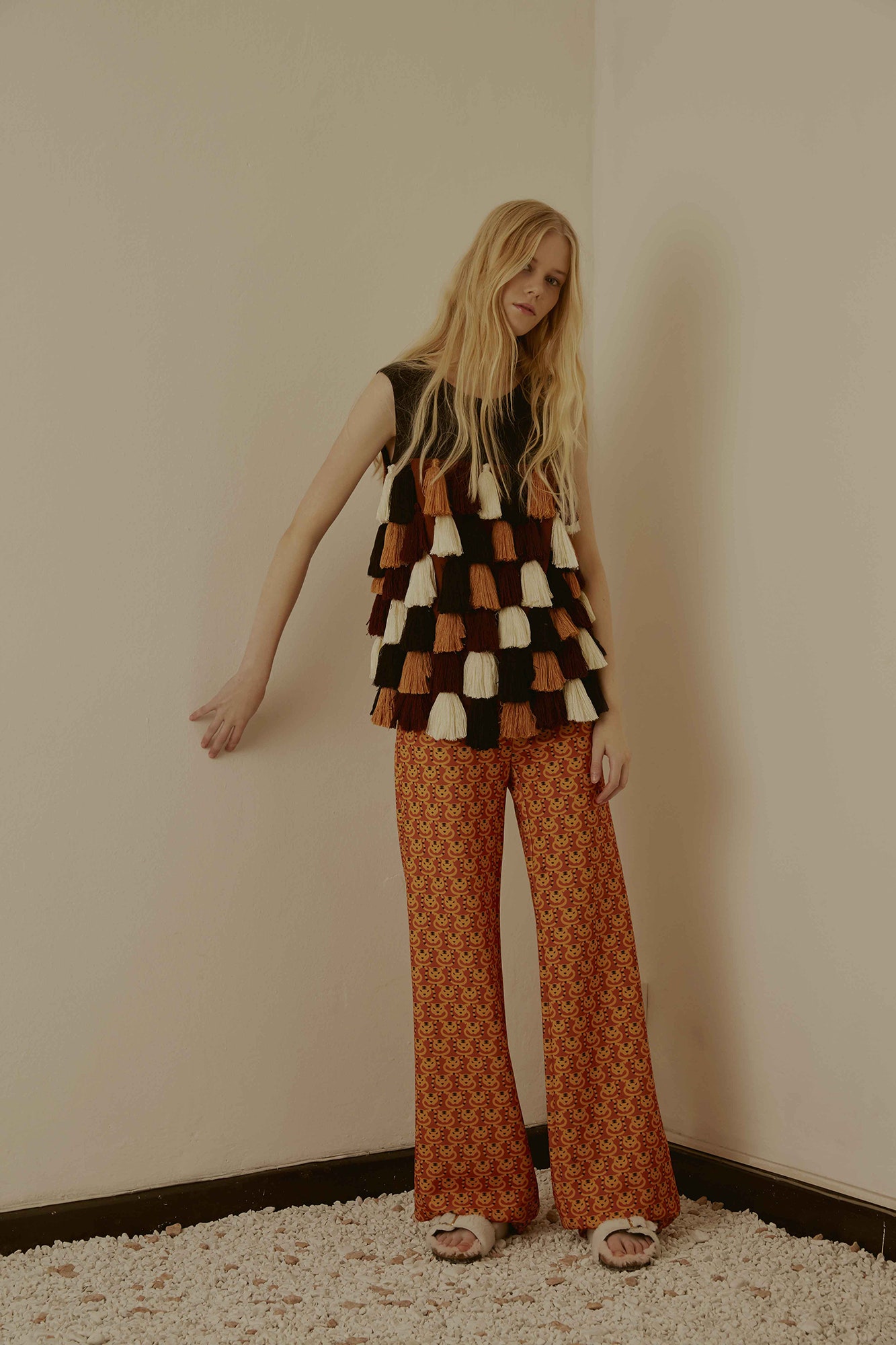 layered top with flared pants