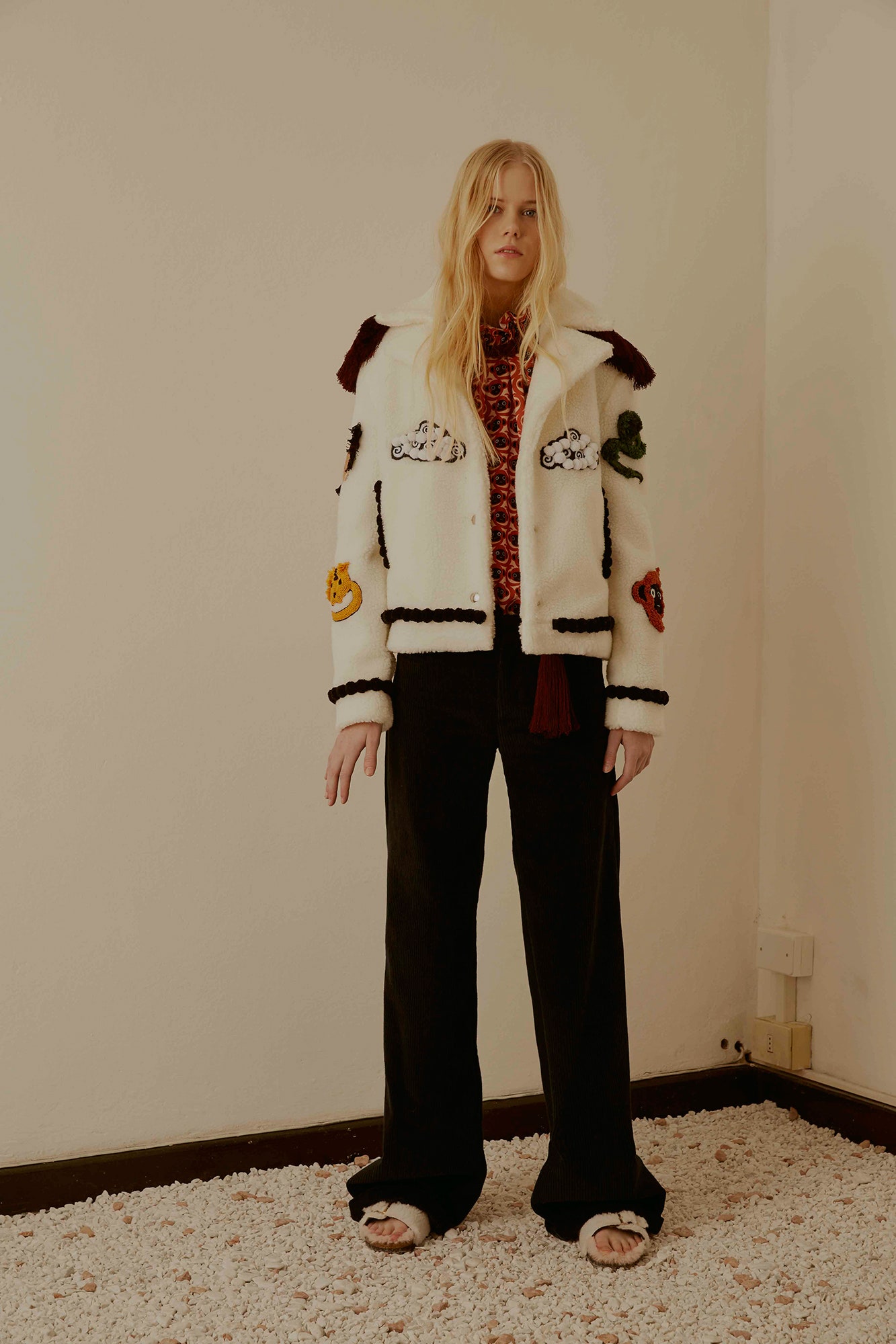 embroidered white jacket with red top