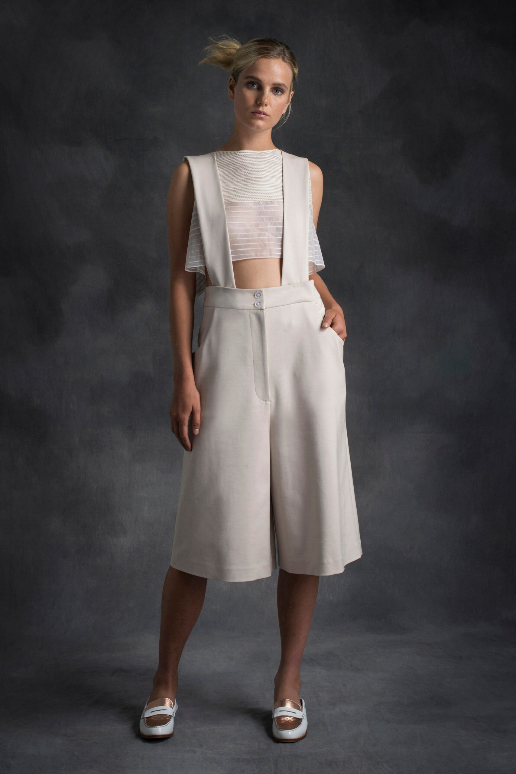 white pleated top with beige culottes