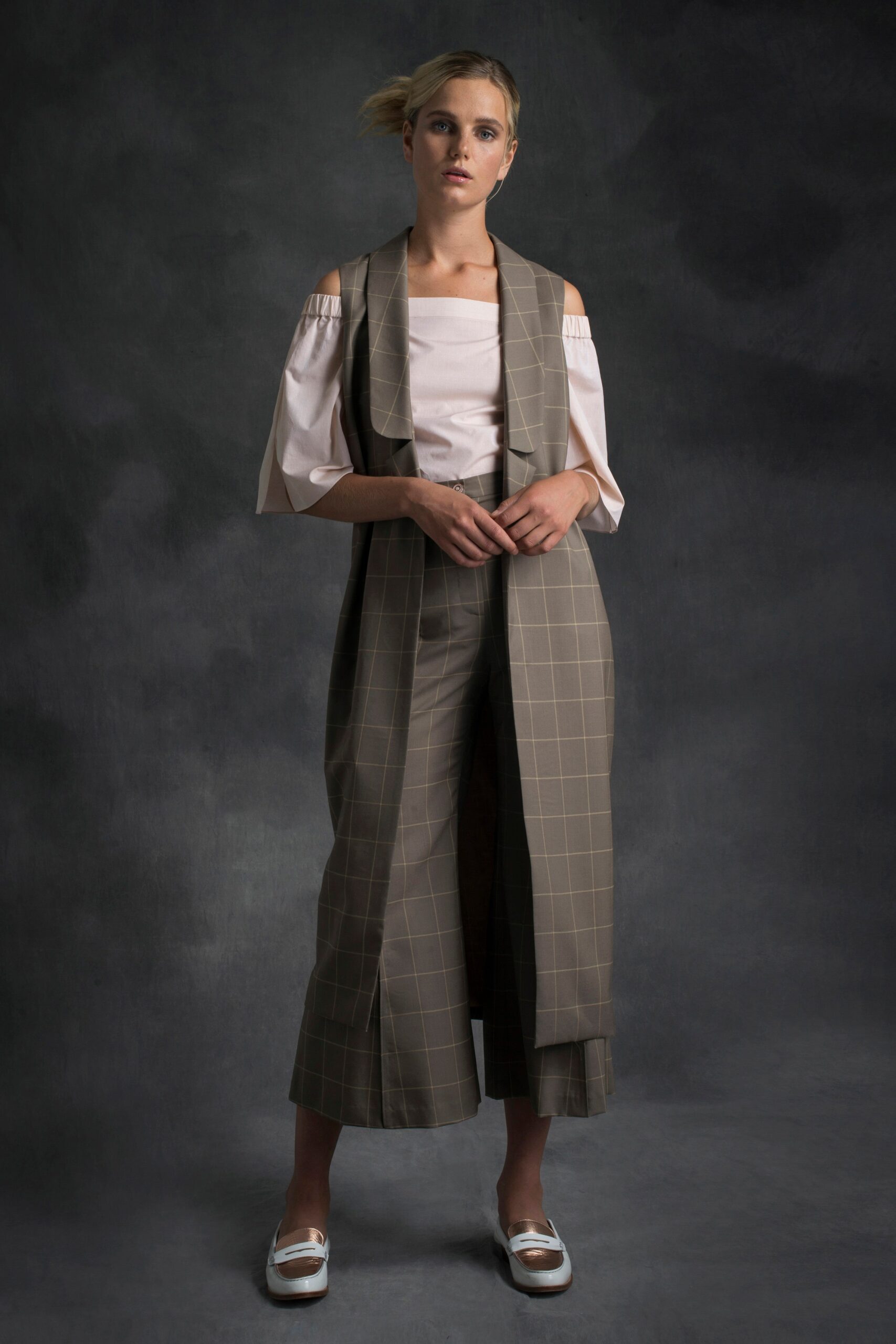 white off-shoulder blouse with beige vest and pants