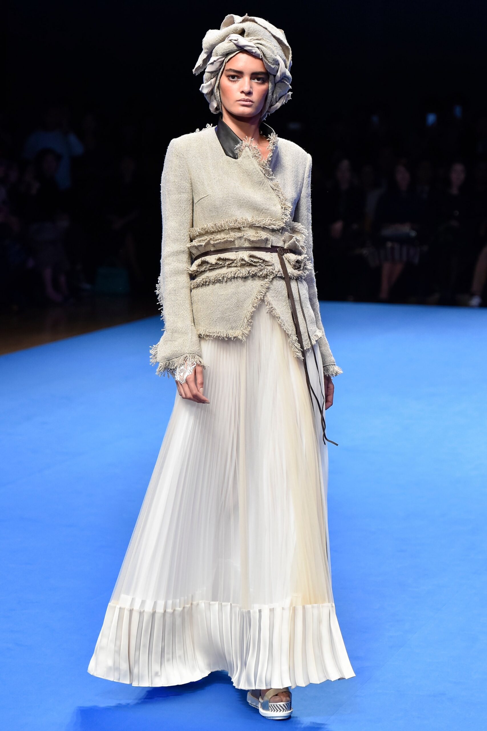 beige tweed blazer with white pleated skirt