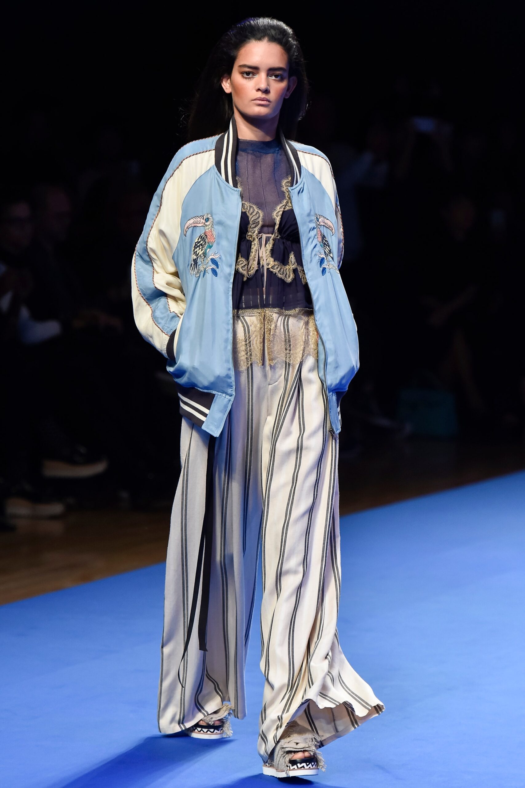 blue embroidered jacket with striped pants
