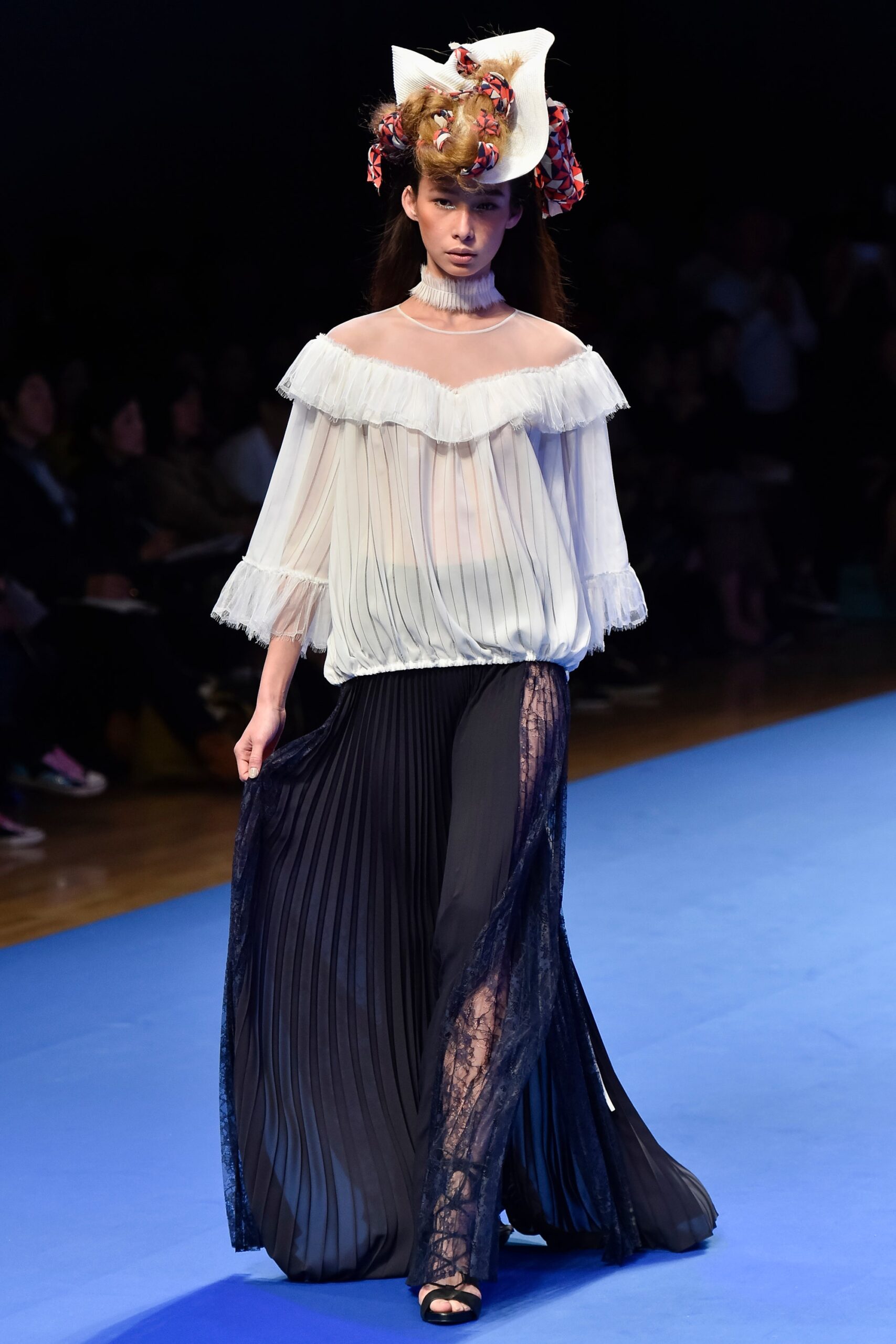 white ruffled blouse black pleated skirt