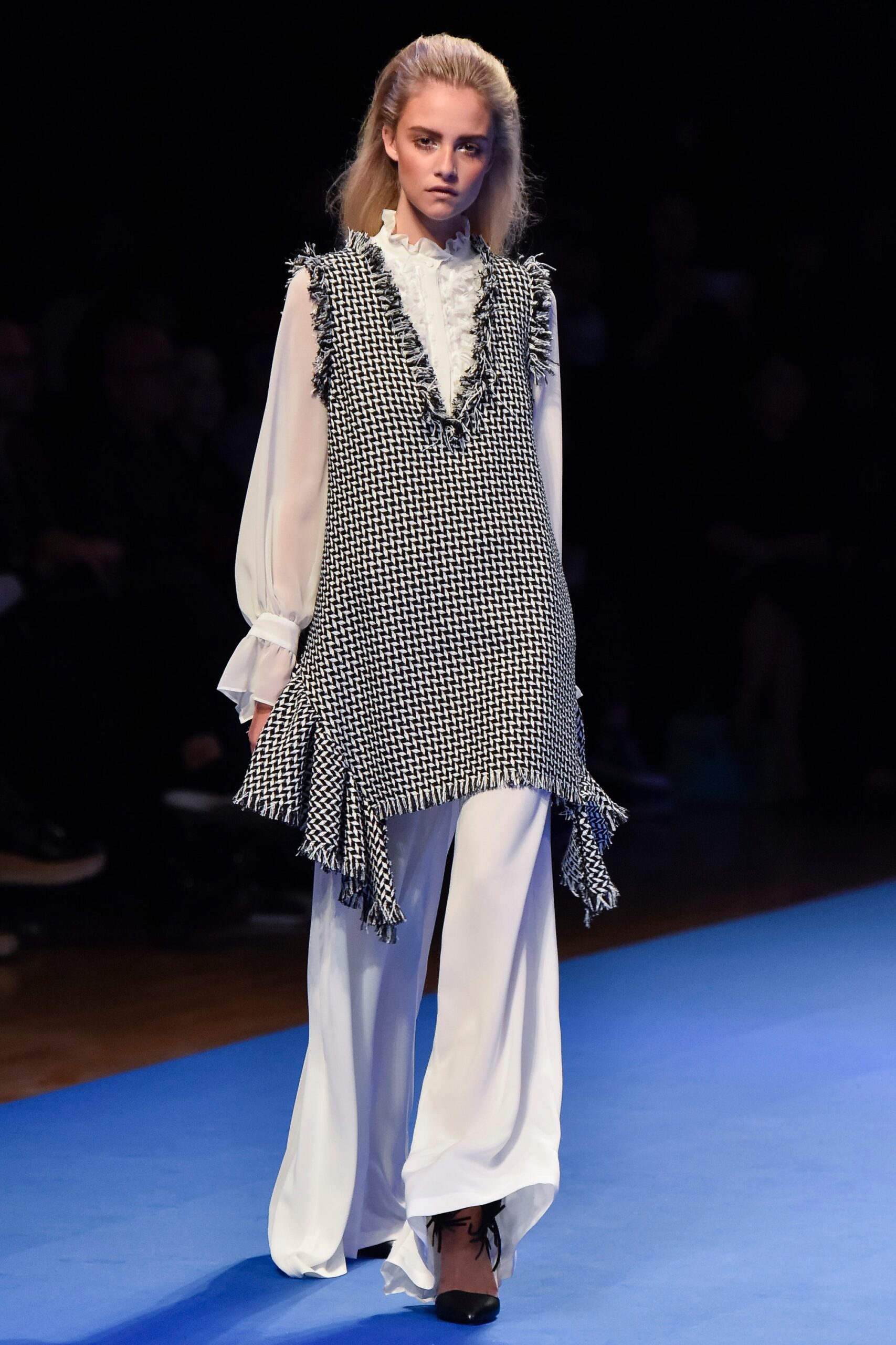 black and white ruffled top with wide-leg pants