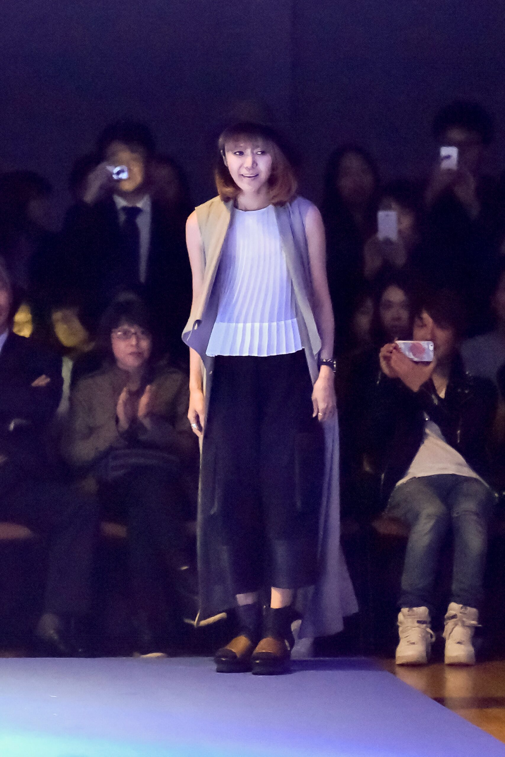 gray vest white pleated top black pants
