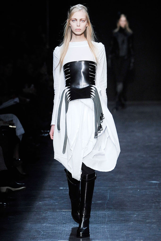 white and black fitted dress with boots
