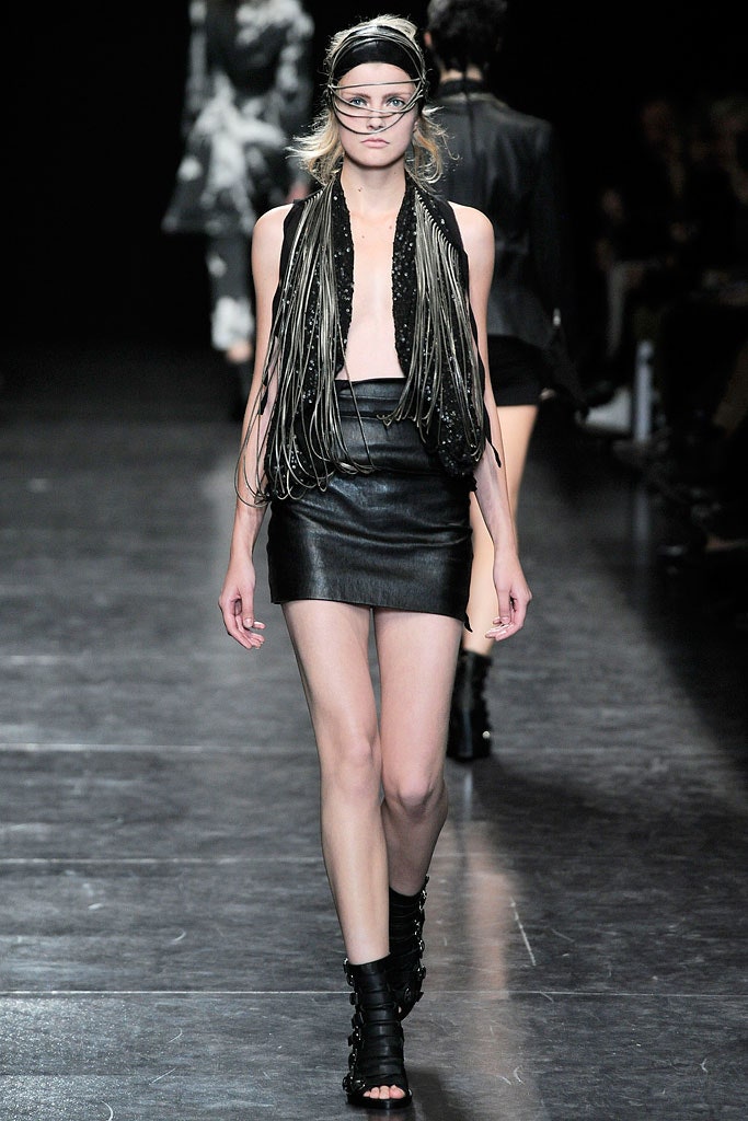 black leather mini skirt and fringed top