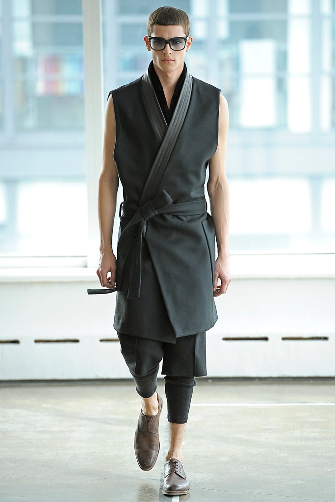 black fitted vest and slim pants