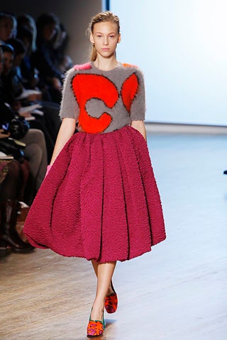 gray wool top with pink pleated skirt