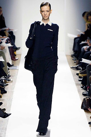 black fitted top and tailored pants