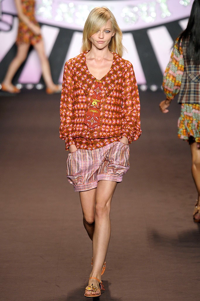 floral blouse and pleated shorts