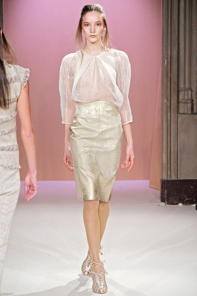 white silk blouse and gold leather skirt