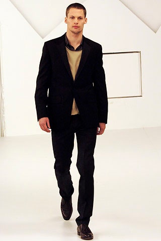 black tailored suit with beige shirt
