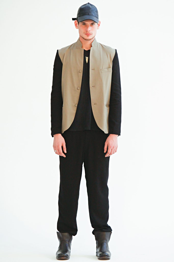 beige tailored vest with black shirt