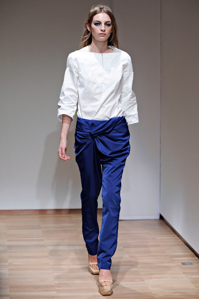 white relaxed top with blue pants
