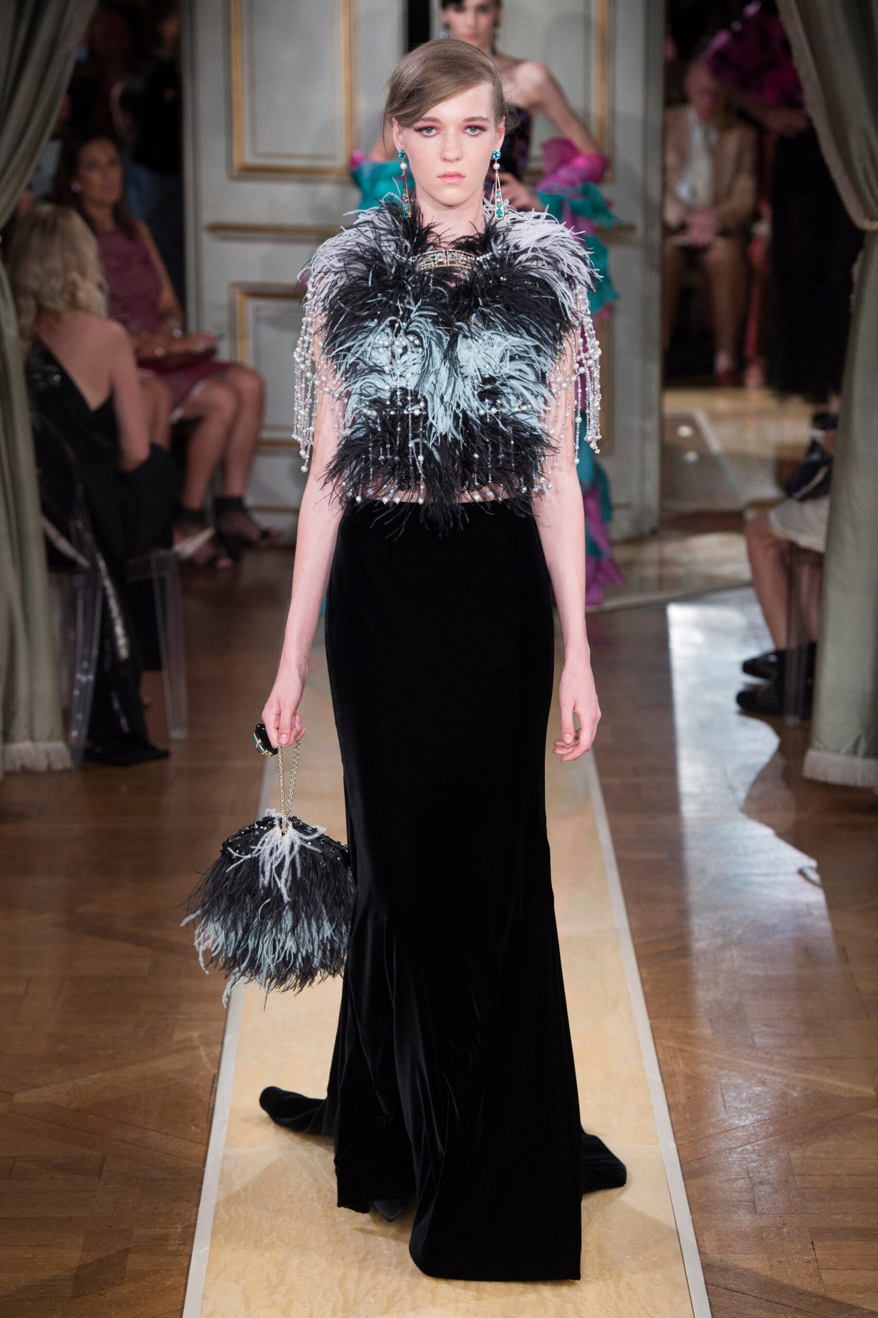 black velvet fitted gown with feather cape