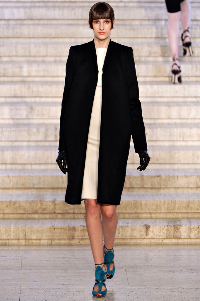 black coat white dress blue shoes