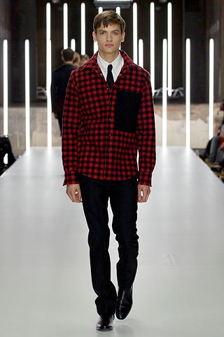 red and black checked shirt with black pants