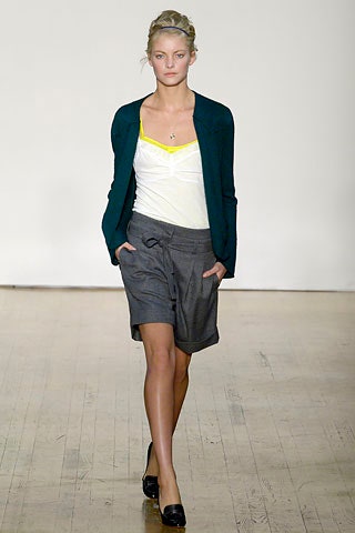 green cardigan white top gray shorts