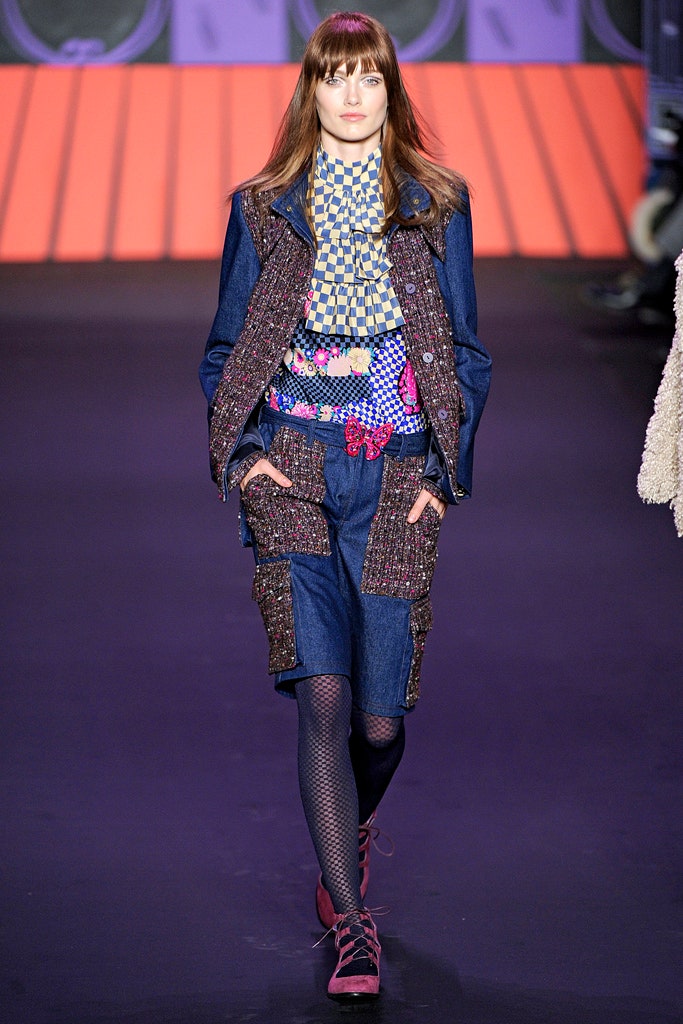 blue denim jacket with multi-colored top