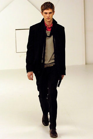 black coat gray sweater red shirt