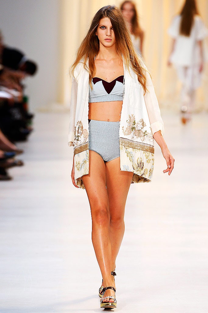 white embroidered top with gray shorts