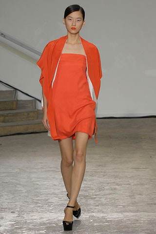 orange silk strapless dress with white cape