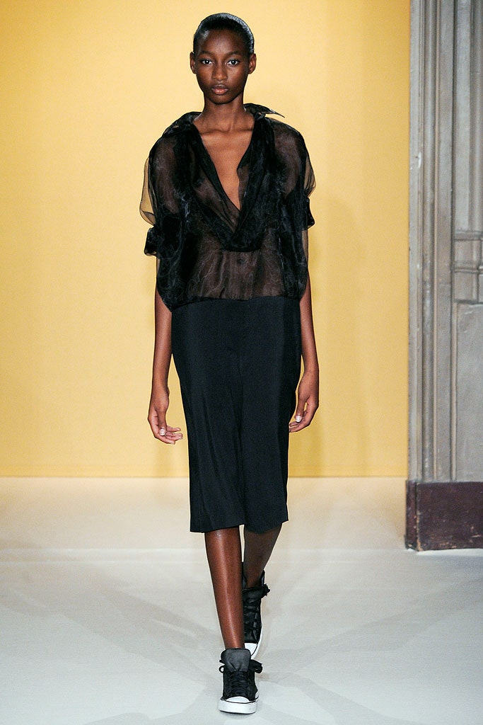 black sheer top with relaxed pants