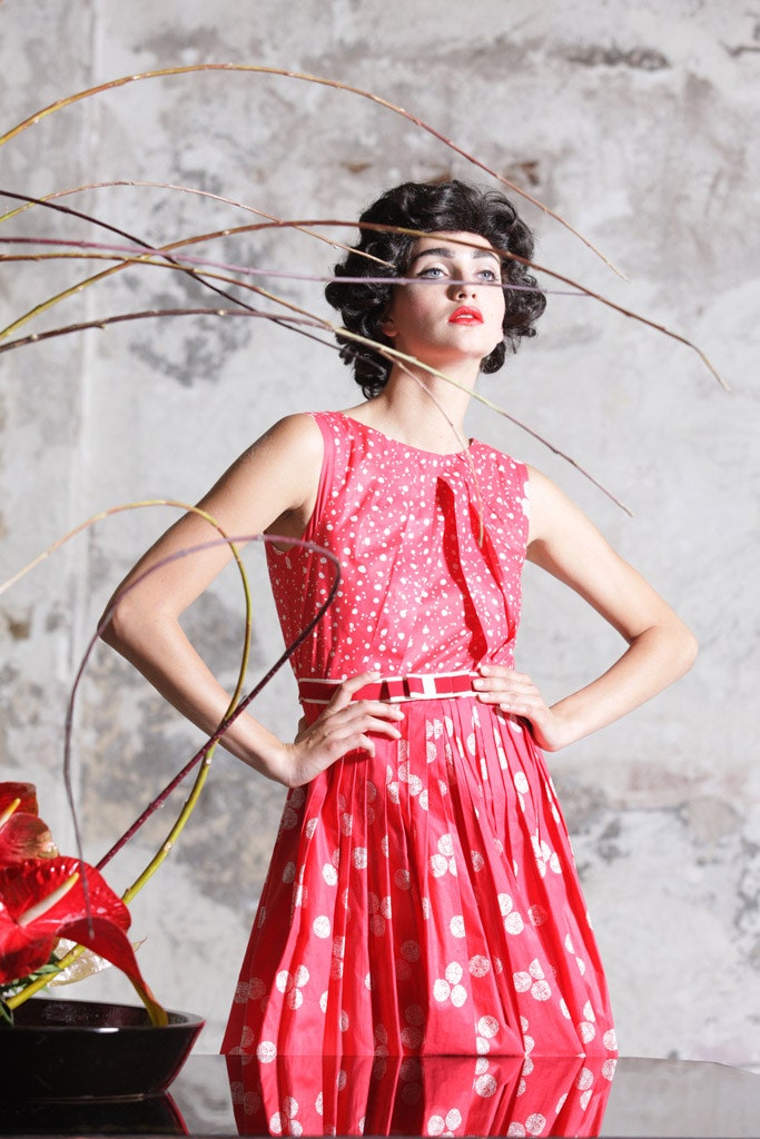 red polka-dot pleated dress