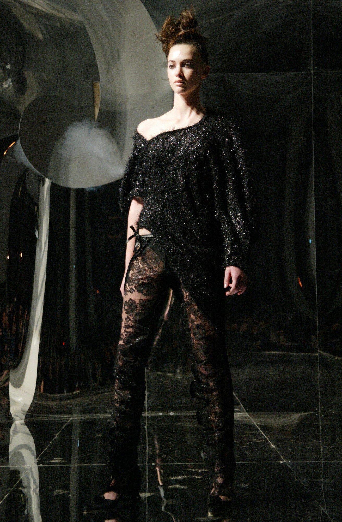 black fringed off-shoulder top and lace pants