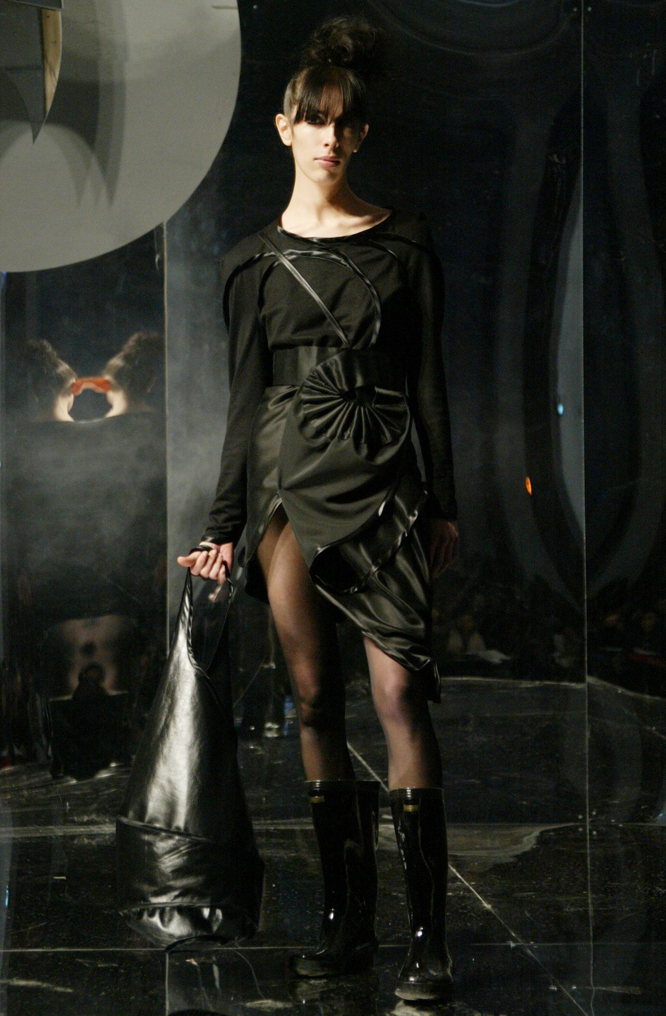 black fitted mini dress with boots